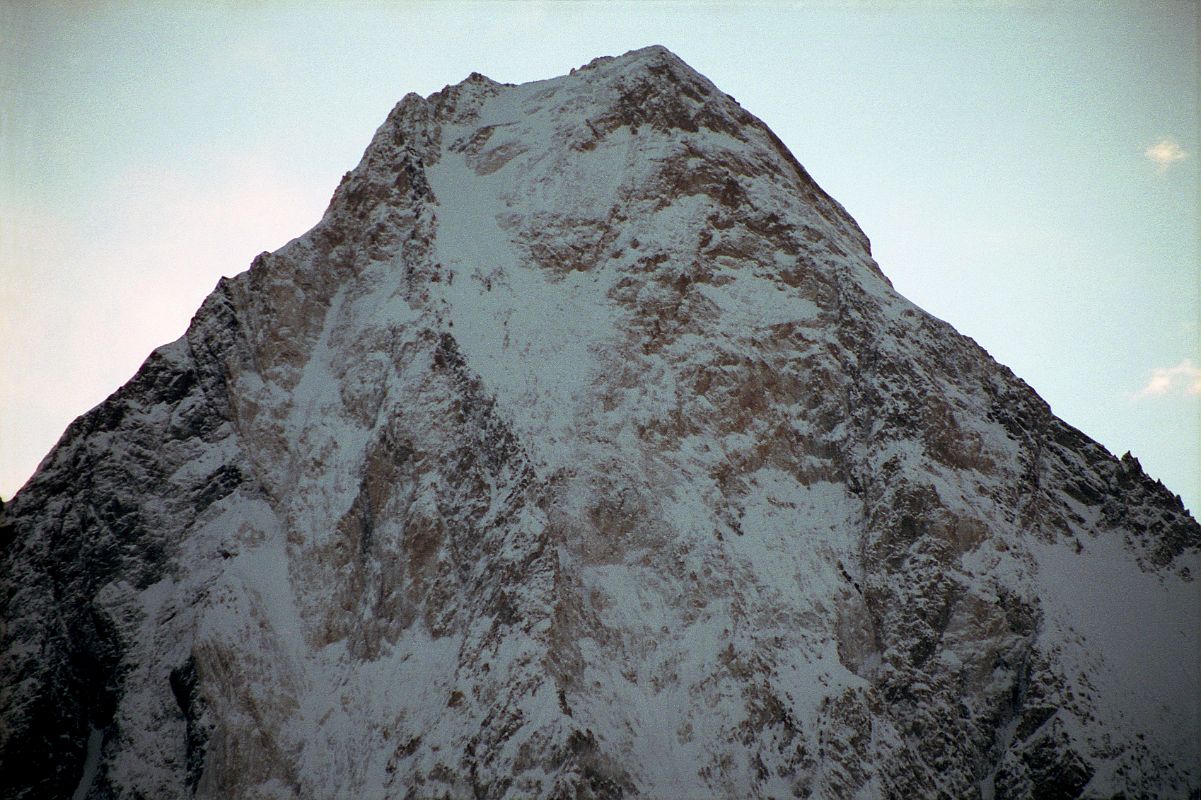 20 Gasherbrum IV Close Up At Sunrise From Concordia Gasherbrum IV close up at sunrise from Concordia. On June 22, 1986 Greg Child, Tim Mcartney-Snape, and Tom Hargis climbed to the North Summit and traversed 450m horizontally to the true Gasherbrum IV Summit, completing the first ascent of the Gasherbrum IV Northwest Ridge. We functioned as a single being. Now on the summit, that being, drunk with euphoria, felt suddenly as if it had been merged with sky and mountain as well to become a single, elemental entity. - Thin Air: Encounters In The Himalaya by Greg Child.
